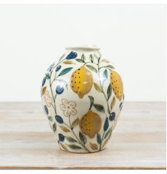 Brighten your space with this charming yellow ceramic lemon vase
