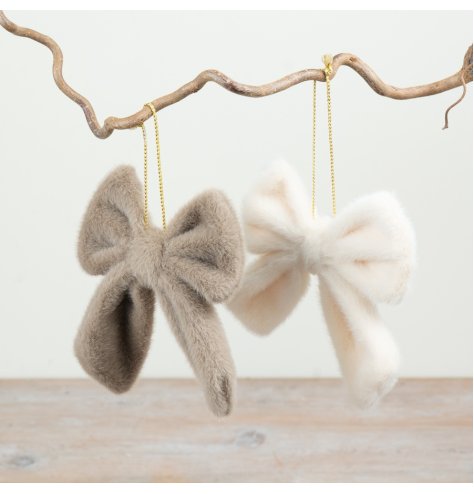 An assortment of 2 faux fur bow decoration with hanging string