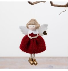 Enhance your collection with this charming angel hanging ornament for a festive and elegant touch.