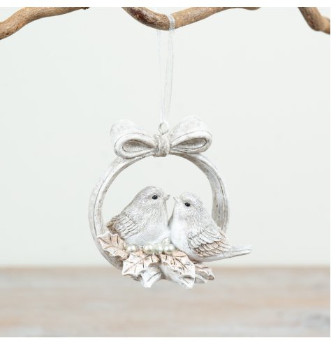 Elegant white wreath adorned with two birds and a bow, ideal for festive tree embellishment