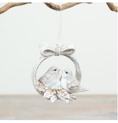 Elegant white wreath adorned with two birds and a bow, ideal for festive tree decoration
