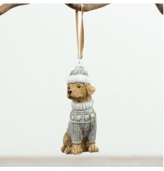 Charming festive dog adorned with jumper and Xmas hat for your tree