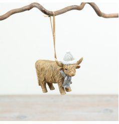 Charming highland cow adorned with cosy hat and scarf