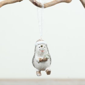 Charming hedgehog ornament with star and ribbon brings festive woodland magic to your tree