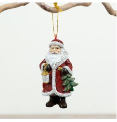Embrace holiday warmth with this delightful red and green Santa tree ornament