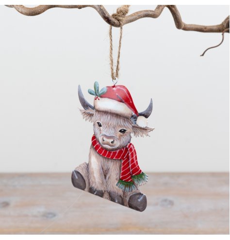 Bring festive cheer to your decor with this charming Highland cow hanging ornament.