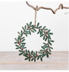 Decorate your door with this green metal wreath hanger for a festive look.