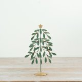 Bring holiday joy with this green metal tree adorned with vibrant red berries.