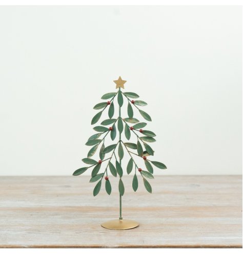 Bring holiday joy with this green metal tree adorned with vibrant red berries.