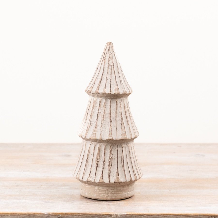 A beautifully crafted decorative tree with a gently distressed white finish and textured, tiered layers