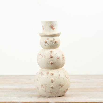 Bring timeless festive charm to your seasonal collection with this distressed cream snowman ornament. 