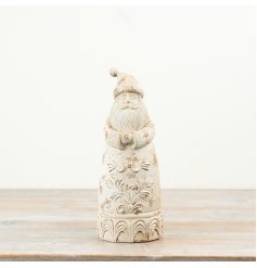 A beautifully detailed Santa ornament finished in a soft distressed cream tone, giving it an authentic vintage look.