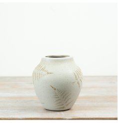 Add organic charm to your space with this exquisitely designed ceramic vase inspired by fern textures.