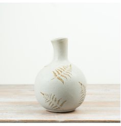 Enhance your decor with this stylish vase featuring a detailed embossed leaf pattern.
