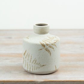 Bring natural elegance to your space with this stylish Ceramic Vase featuring a leaf pattern.
