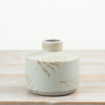 Add charming botanical flair to your space with this elegantly designed ceramic decorative vase.