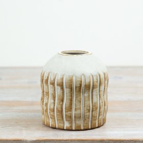 Crafted in ceramic with a soft earthy finish