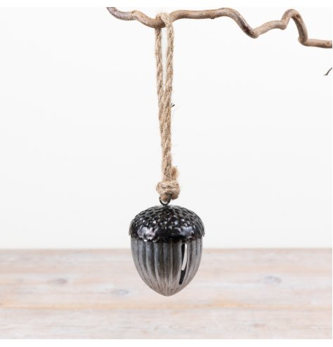 A charming woodland-inspired acorn bell complete with metallic finish and rustic twine hanger