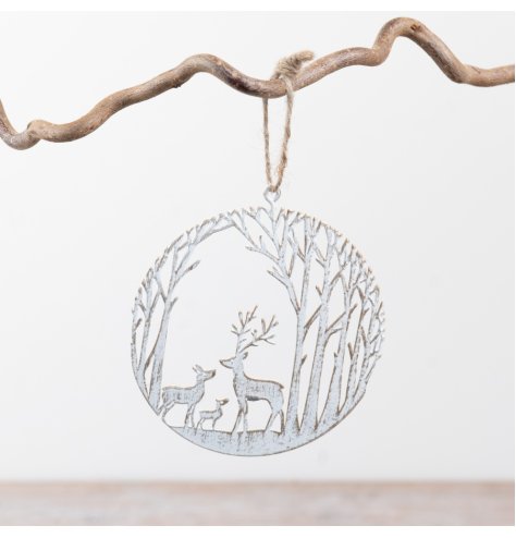 Enhance seasonal decor with this delicate metal hanging ornament featuring a subtle woodland design.