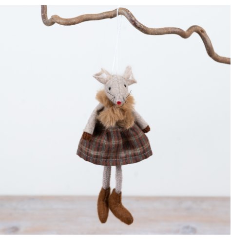 Featuring textured fabric finishes, a traditional tartan skirt and soft neutral tones