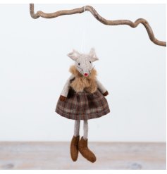 Featuring textured fabric finishes, a traditional tartan skirt and soft neutral tones