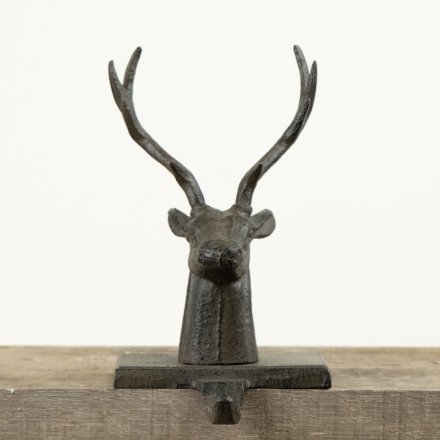 A statement festive accessory crafted in solid cast iron with an imposing stag head design.
