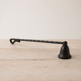 a durable cast iron snuffer with an elegant rustic design