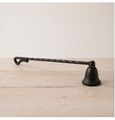 a charming cast iron candle snuffer with a rustic design