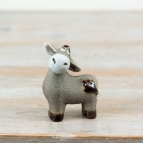 A donkey ornament Finished in a soft, natural taupe glaze with contrasting darker hooves and tail detail