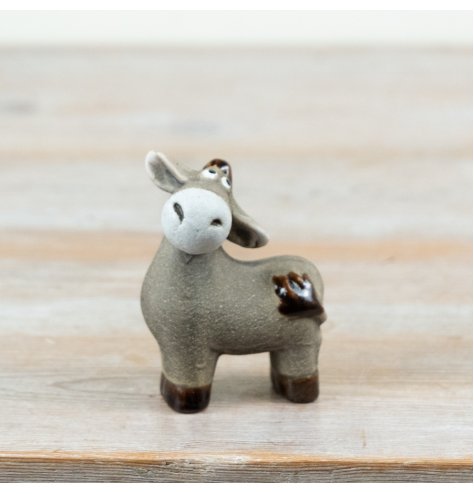 Bring rustic charm to your home with this charming donkey ornament.