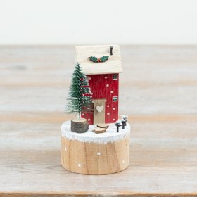 Add a cosy seasonal touch to festive displays with this charming wooden winter house decoration.