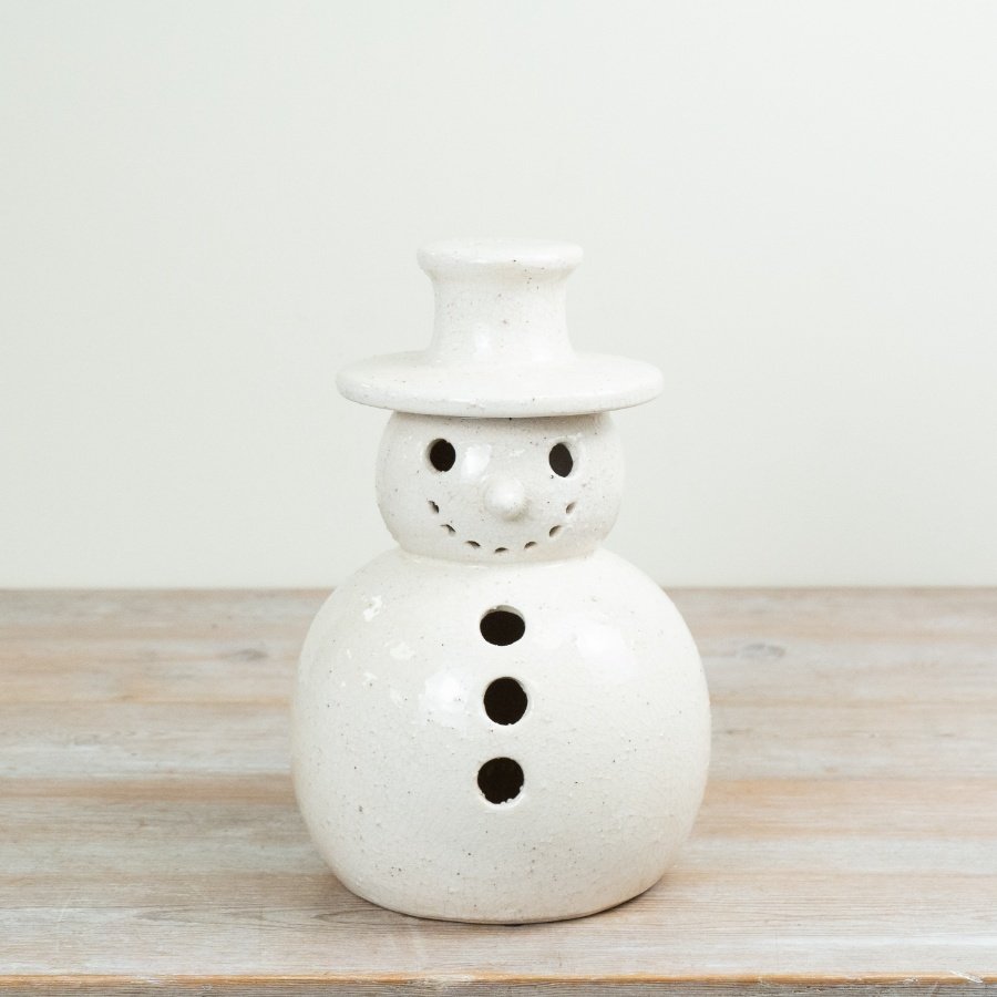 Ssnowman ornament is crafted from stoneware and finished with a subtle crackle glaze that adds texture and character. 