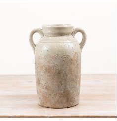 A stylish terracotta urn vase  with a softly aged finish and twin handles for timeless appeal.