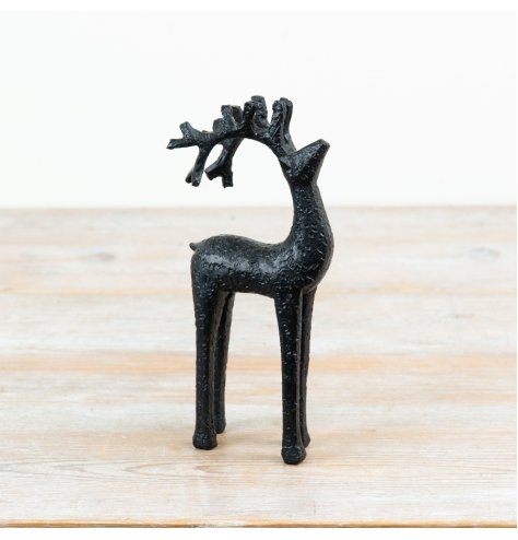 A decorative black deer ornament with a textured finish and elegant antlers