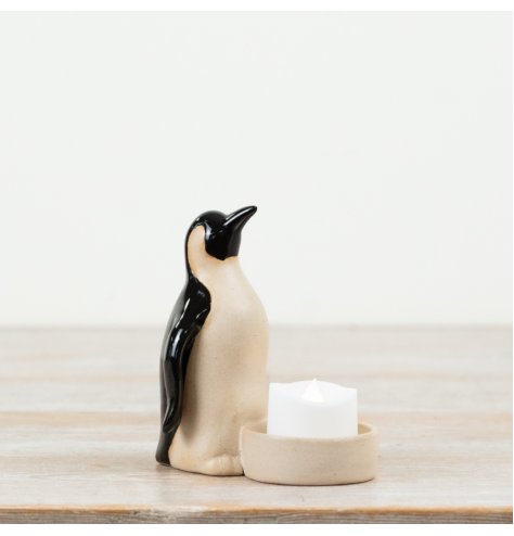 Add charm to your space with this chic ceramic penguin t-light holder.