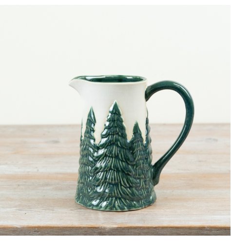 A charming ceramic jug featuring raised Christmas tree detailing in rich festive green tones.