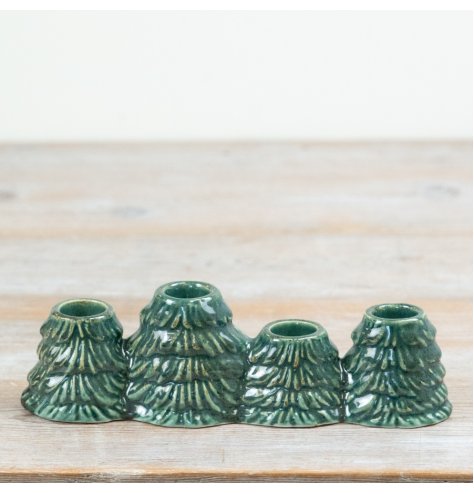 Add elegant charm to your Christmas decor with this finely crafted ceramic taper candle holder.