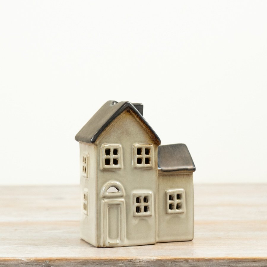A beautifully simple ceramic house t-light holder with soft cream glaze and contrasting grey roof detail. 