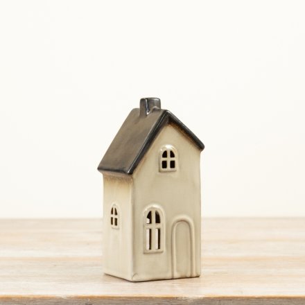 Tall ceramic house t-light holder with a soft cream glaze and contrasting grey metallic roof detail.