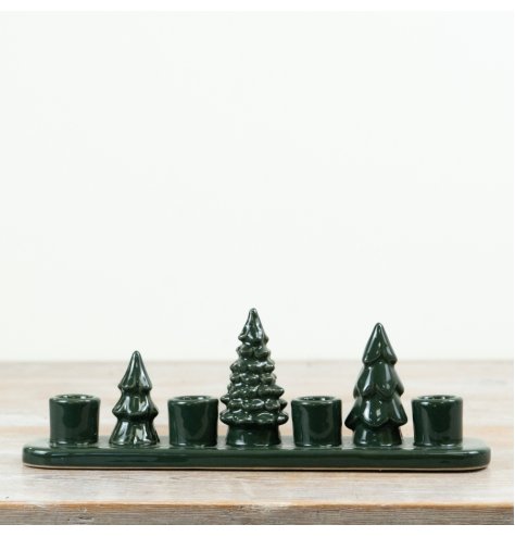Bring natural charm to your space with this dark green Tree Candle Holder.
