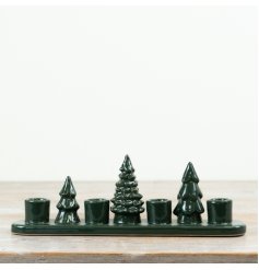 Add a touch of natural elegance with this dark green Tree Candle Holder
