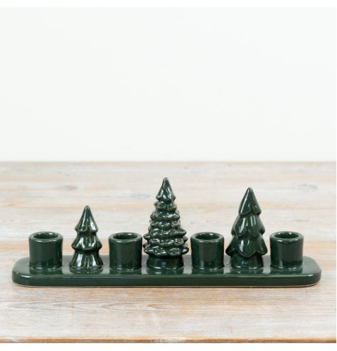 Bring natural charm to your space with this dark green Tree Candle Holder.