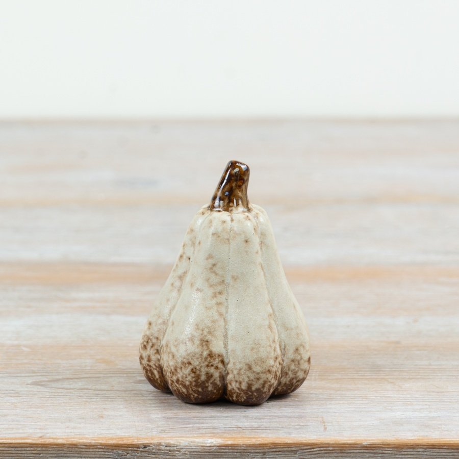 Bring cozy fall vibes to your space with this intricately designed pumpkin decor.