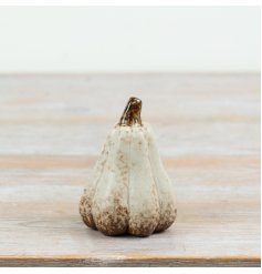 Bring cozy autumn vibes to your space with this intricately designed pumpkin decor.