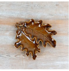 Featuring a detailed oak leaf silhouette with integrated acorn motif