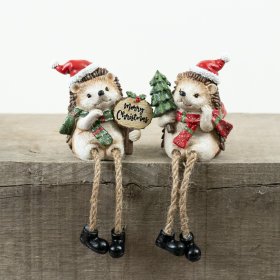 Bring holiday cheer with this cute Resin Christmas Hedgehog sitting on your shelf.