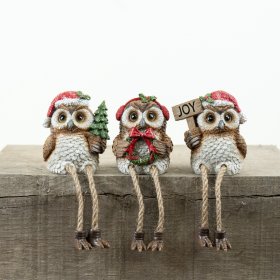 Bring holiday cheer to your space with this charming Resin Owl Xmas Shelf Sitter.