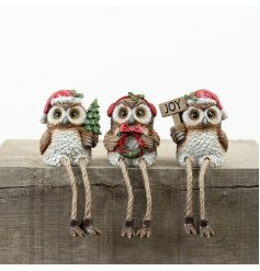 Bring holiday cheer with this charming Resin Xmas Owl Shelf Sitter for your festive decor.