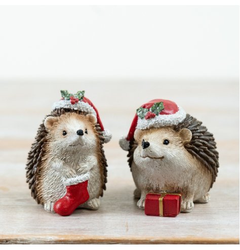 Bring holiday cheer with this cute 2-piece Resin Hedgehog Christmas Table Décor set.