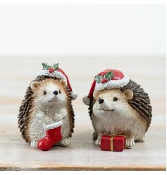 Bring holiday cheer with this cute 2-piece Resin Hedgehog Christmas Table Décor set.